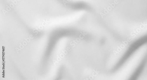 Abstract white fabric background with soft folds and subtle shadows, creating a smooth and elegant texture.