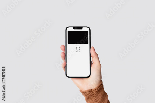 Hand holding smartphone for contactless mobile payment