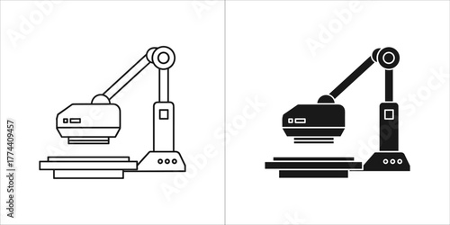Two industrial machines, one outlined and one solid black, on a
