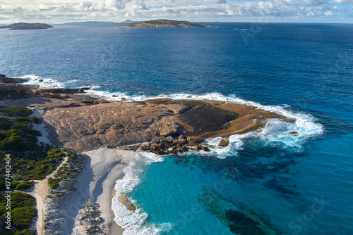Waves curve around the rocks in a foamy grip of nature