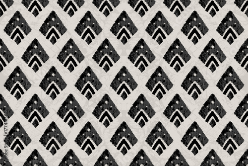 Geometric Ikat Diamond Pattern in Monochrome Tones.Ethnic Ikat pattern in tribal, folk embroidery, and Mexican style Aztec geometry for Graphic Arts, Carpet Design, Wallpaper, Wrapping, and Clothing.