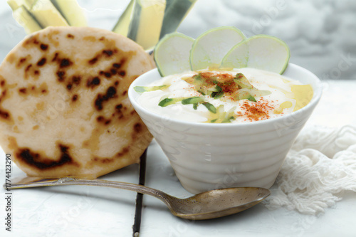 Savory yogurt dip with fresh flatbread and spices