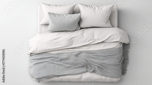 Minimalist white bed with pillows duvet and gray knitted throw blanket top view isolated on white background