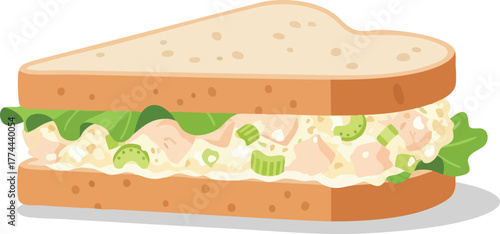 A delicious sandwich with chicken salad, lettuce, and celery between two slices of bread.