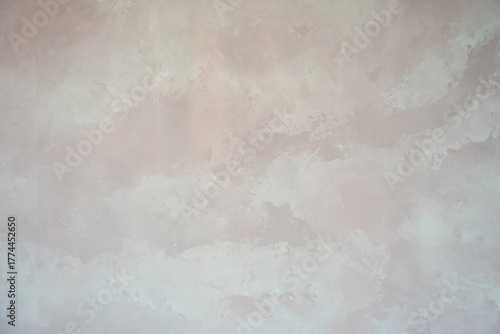 Subtle mauve plaster texture with blended hues and an abstract, elegant finish, suitable for a background or design element.