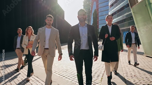 Indian business leader man walking together with company Team - Group of professionals in the city