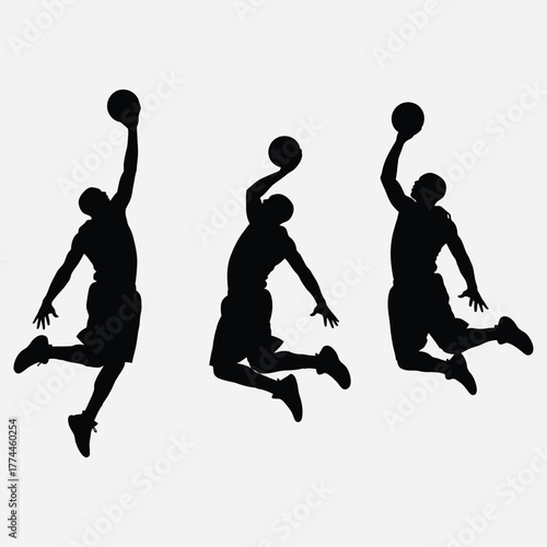 Silhouettes of basketball players in mid-air, executing powerful jumps and reaching for the ball during a dynamic game