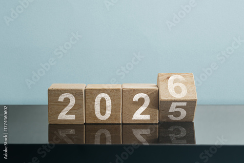 New Year Transition Wooden Blocks Changing from 2025 to 2026, symbolizing new beginnings, business and holiday concept, happy new year, new year background, celebration concept.