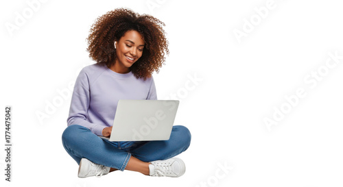 Smiling young African American woman using a laptop for remote work or online studying. isolated PNG with Transparent Background