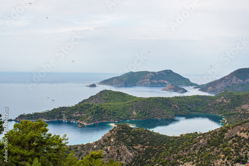 Fototapeta Naklejka Na Ścianę i Meble -  Oludeniz in Turkey. A beautiful tourist destination showing the view from the Lycian way looking down at the famous Blue lagoon and Turkish coast. 