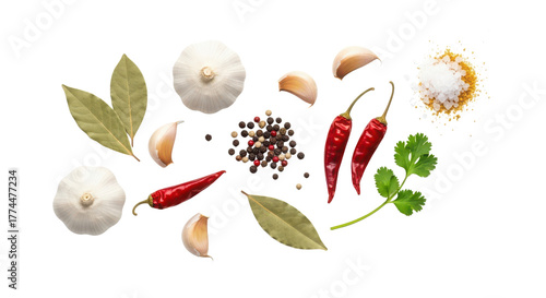 Composition of cooking spices and herbs including chili peppers, garlic, peppercorns, and bay leaves isolated PNG with Transparent Background