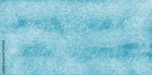 Textured blue ice surface with white scratch marks and subtle cloud patterns image