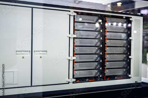 Modern industrial battery energy storage system (BESS) cabinet with visible battery modules, representing sustainable power solutions and grid infrastructure technology.
