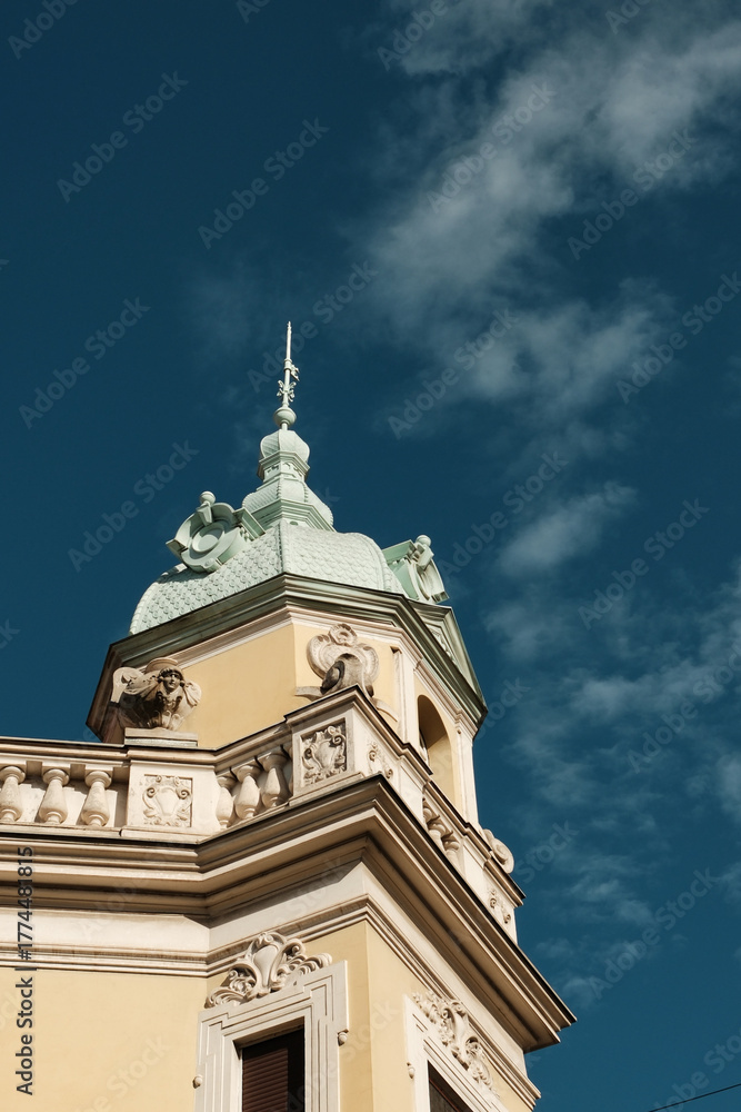 Fototapeta premium Closeup view of ornate architectural tower and clear blue sky in Belgrade, Serbia