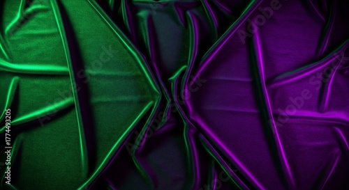 Elegant silky fabric texture illuminated by contrasting vibrant green and purple light