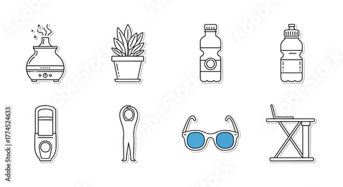 desk items for a healthy workspace including diffuser plant water bottles and stand-up desk promoting ergonomic setup and wellness design.