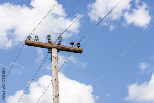 low-current power line on a wooden pole
