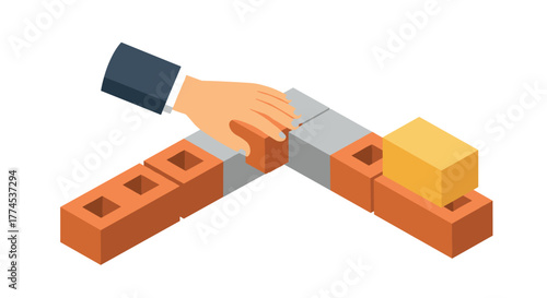 Hand arranging blocks in an isometric construction concept