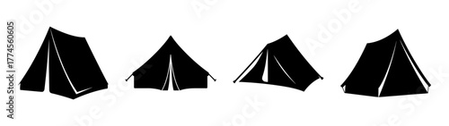 Four simple black tents lined up for camping outdoor adventure and recreation