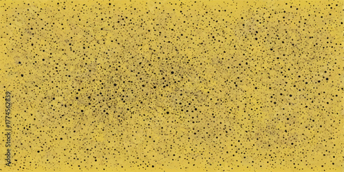 Macro closeup of yellow sponge texture with golden bubbles and water drops on a wet surface