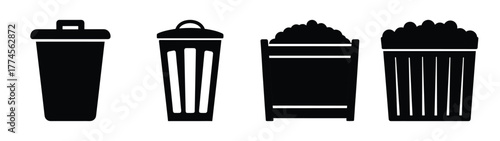 Collection of four black silhouette trash cans and bins icon set