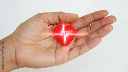 Wallpaper Mural Heart health care video with glowing red heart and ECG line in hand Torontodigital.ca