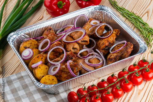 Grilled chicken set, shashlik on a wooden table