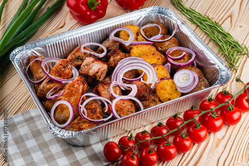 Grilled meat set, shashlik on a wooden table
