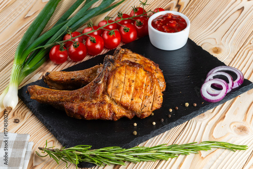 Grilled pork ribs, shashlik on a wooden table