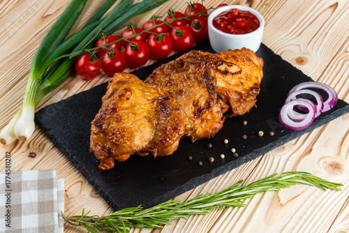 Grilled chicken shashlik on a wooden table