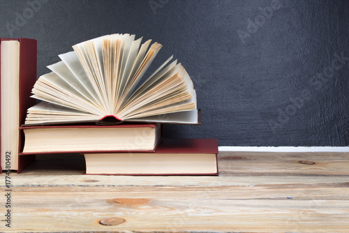 open book, books on the school board. Back to school. Education. Copy space for text.
