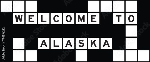Alphabet letter in word welcome to alaska on crossword puzzle background