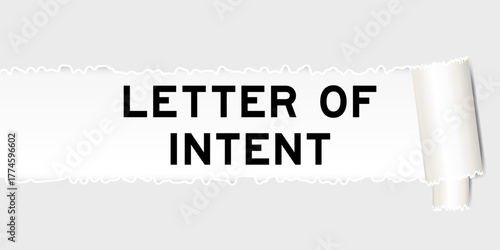 Ripped gray paper background that have word letter of intent under torn part