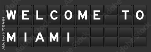 Black color analog flip board with word welcome to miami on gray background