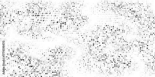 Abstract halfton background. A wave of black dots on a white background. The pattern is chaotic