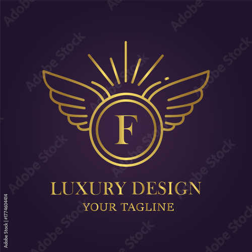 Elegant golden winged emblem with letter f on a dark purple background, representing luxury and design