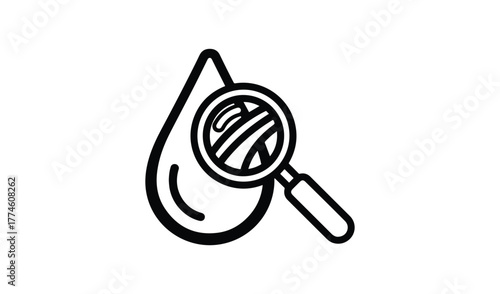 Magnifying glass examining a drop of liquid or blood