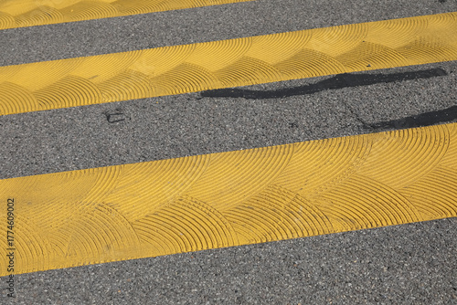 Yellow zebra crosswalk marking on the road