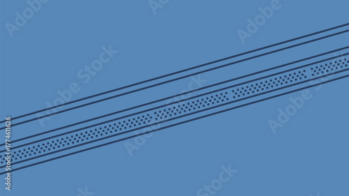 A close up view of a blue surface with a linear pattern of dots and lines diagonally across it