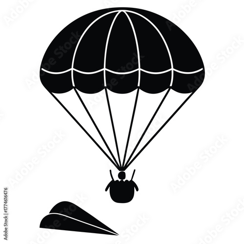 Silhouette of a skydiver with a parachute descending from the sky