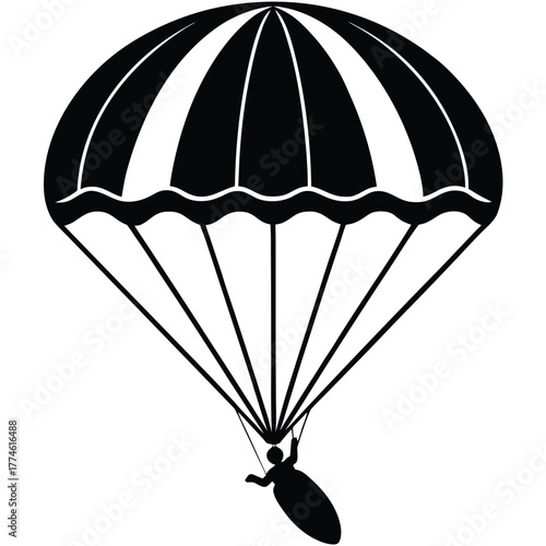 Silhouette of a skydiver with a parachute descending from the sky