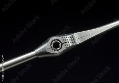 Macro shot of a finely crafted metallic instrument, highlighting its intricate details and polished surfaces, symbolizing accuracy and meticulous control ,tip ,measurement ,exact