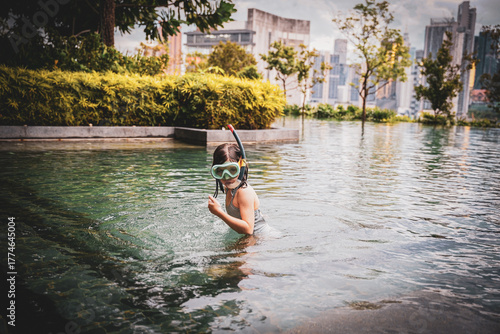 girl in the swimming pool in Kuala Lumpur, Malaysia