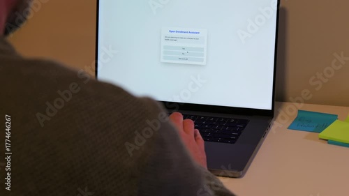 Middle-Aged Man Completing Open Enrollment Questions Via Artificial Intelligence AI Assistant Chat Bot