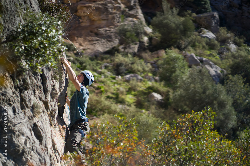 Obraz premium Man is climbing, hiking in the mountains.