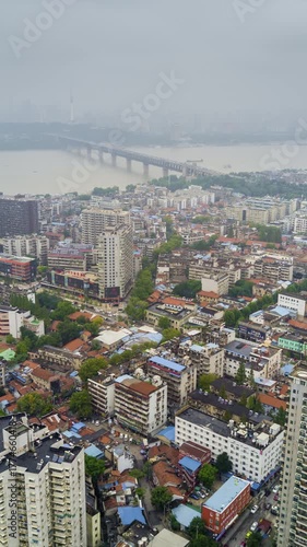 cloudy day time wuhan cityscape yangtze riverside aerial vertical panorama 4k timelapse china