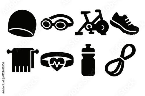 Bold Triathlon Gear Icons. Triathlon training gear silhouette set: swim cap, goggles, bike trainer, sneakers, towel, heart rate monitor, drink bottle, resistance band.