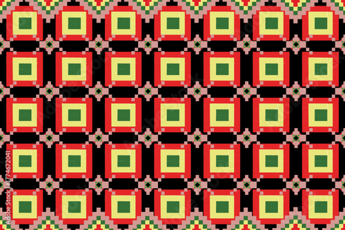 A captivating geometric pattern featuring bold squares in shades of green, red, and yellow set against a deep black background. The repetitive symmetry and vibrant color contrast create a mesmerizing 