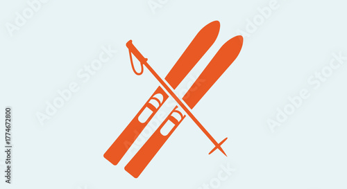 Orange Skis and Ski Poles Crossed for Winter Sports and Recreation.