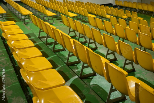 Rows of Yellow Retro Seats in an Empty Stadium